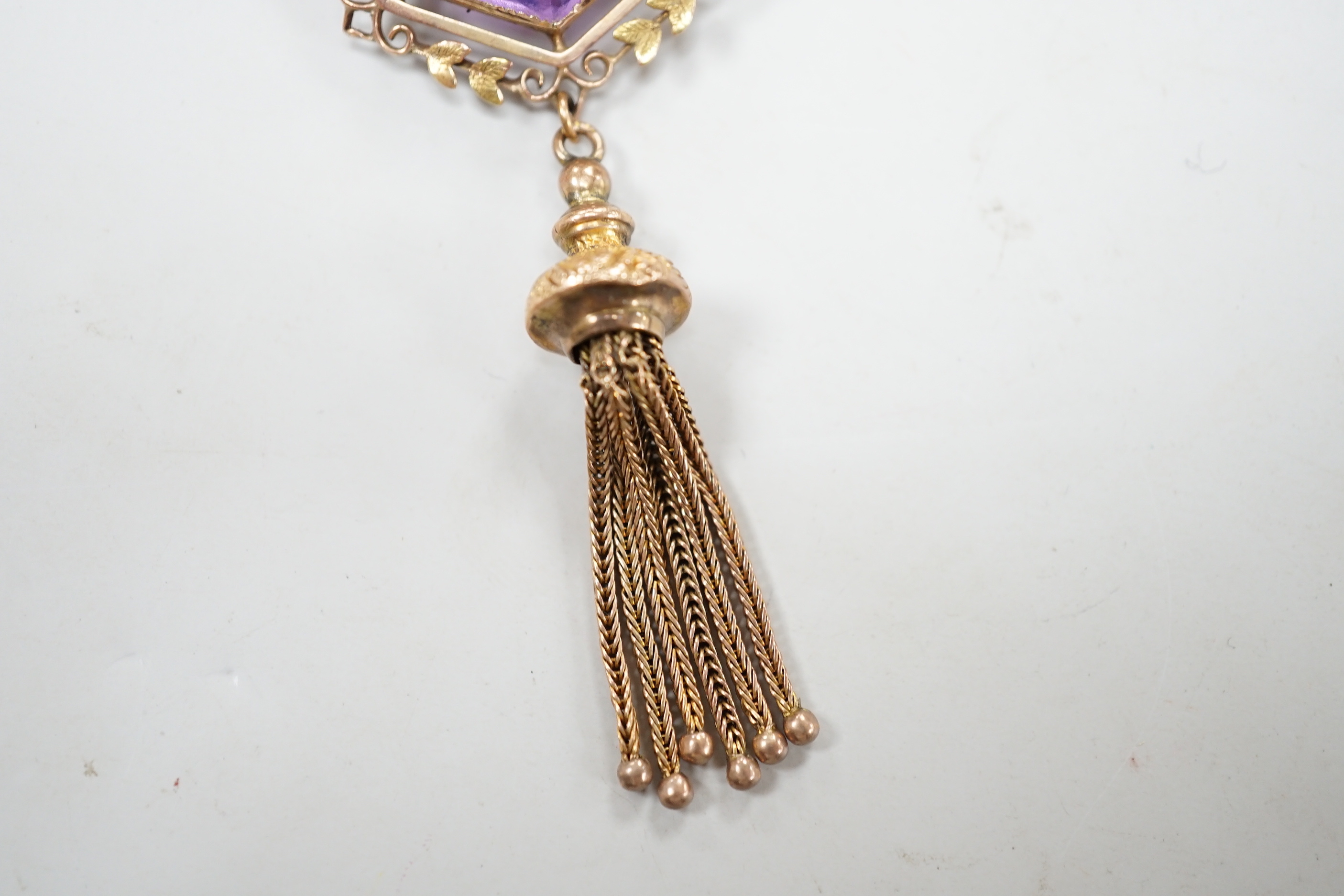 An Edwardian 9ct and hexagonal cut amethyst set tassel drop brooch, overall 75mm, gross weight 10.7 grams.